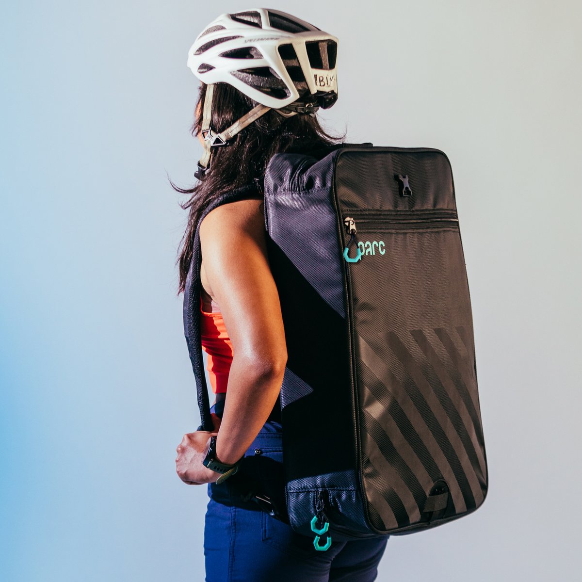 Parc cycling gear bag worn by female cyclist as a backpack for hands free cycling gear transportation and storage.